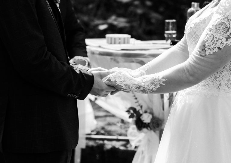 Wedding ceremony holding hands