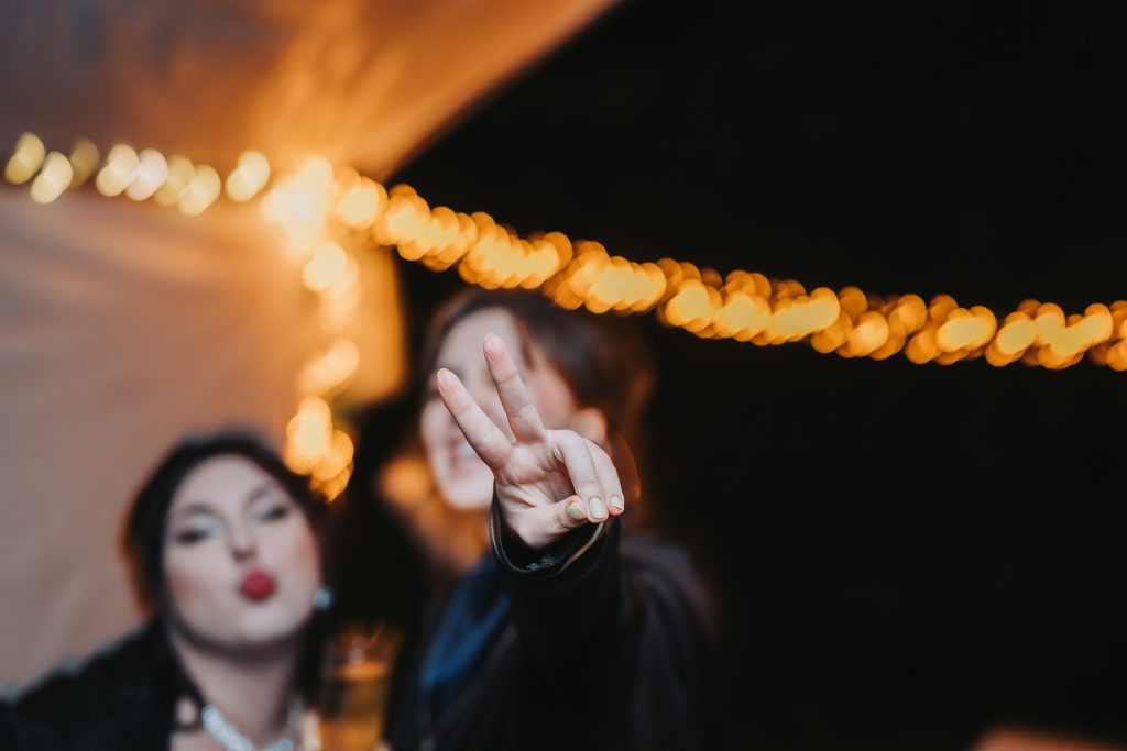 Dancing and peace sign